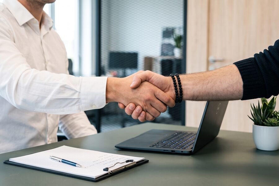 Business manager shaking hands with a client