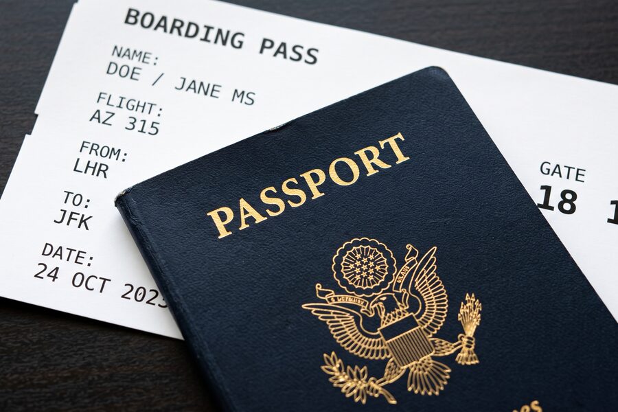 Passport and boarding pass on a desk